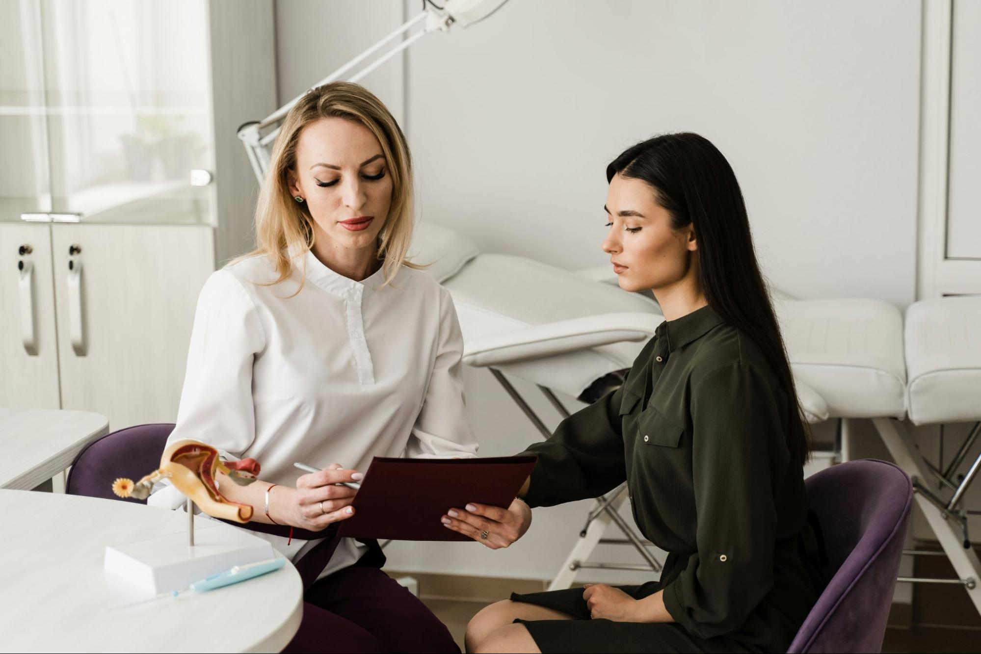A pelvic health specialist at Free Motion Physical Therapy in Clearwater reviewing a personalized treatment plan with a patient.